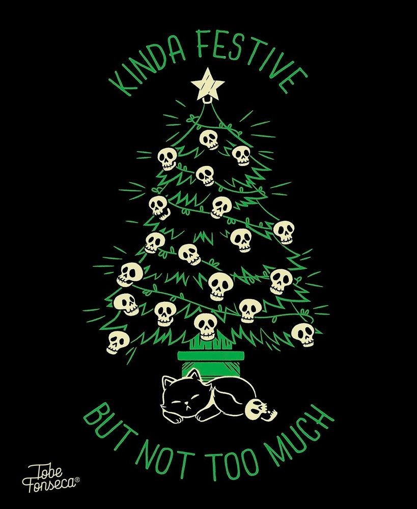 Christmas tree decorated with skull ornaments. A black cat sleeps underneath 