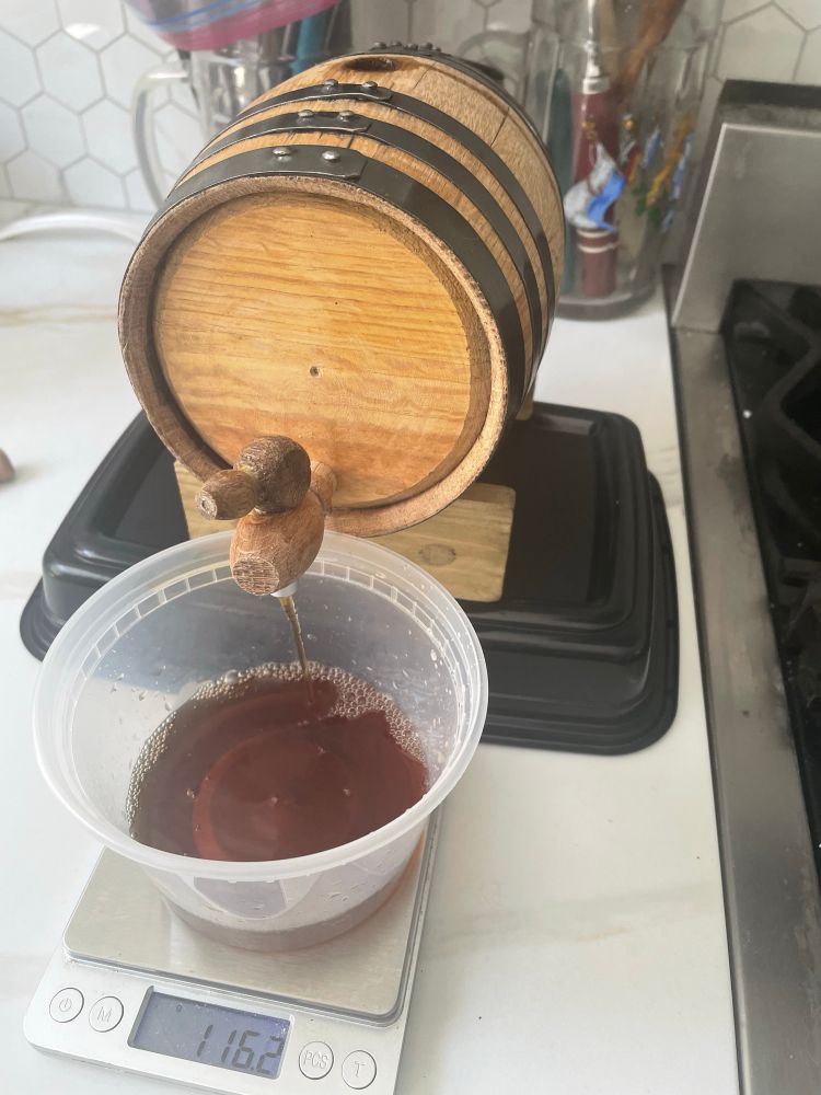 Photo of retrieving the aged sherry from the barrel.