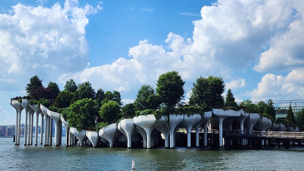A verdant park raised on stilts above the water. 