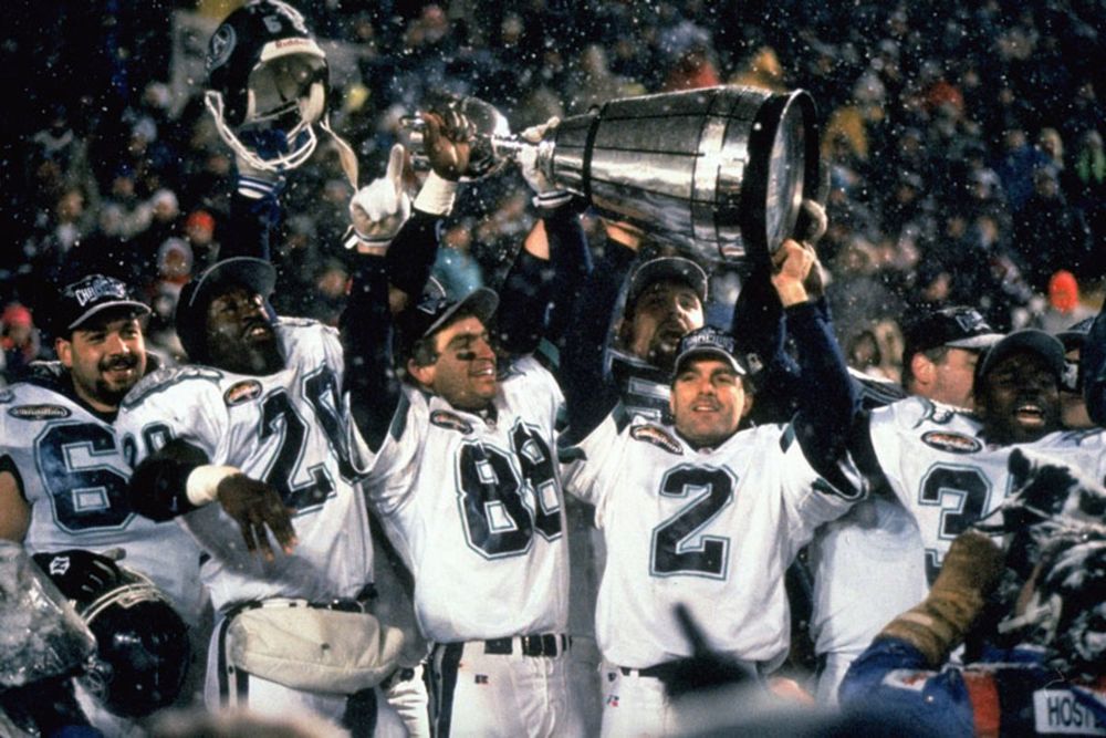 Doug Flutie (and others) hoisting the Grey Cup