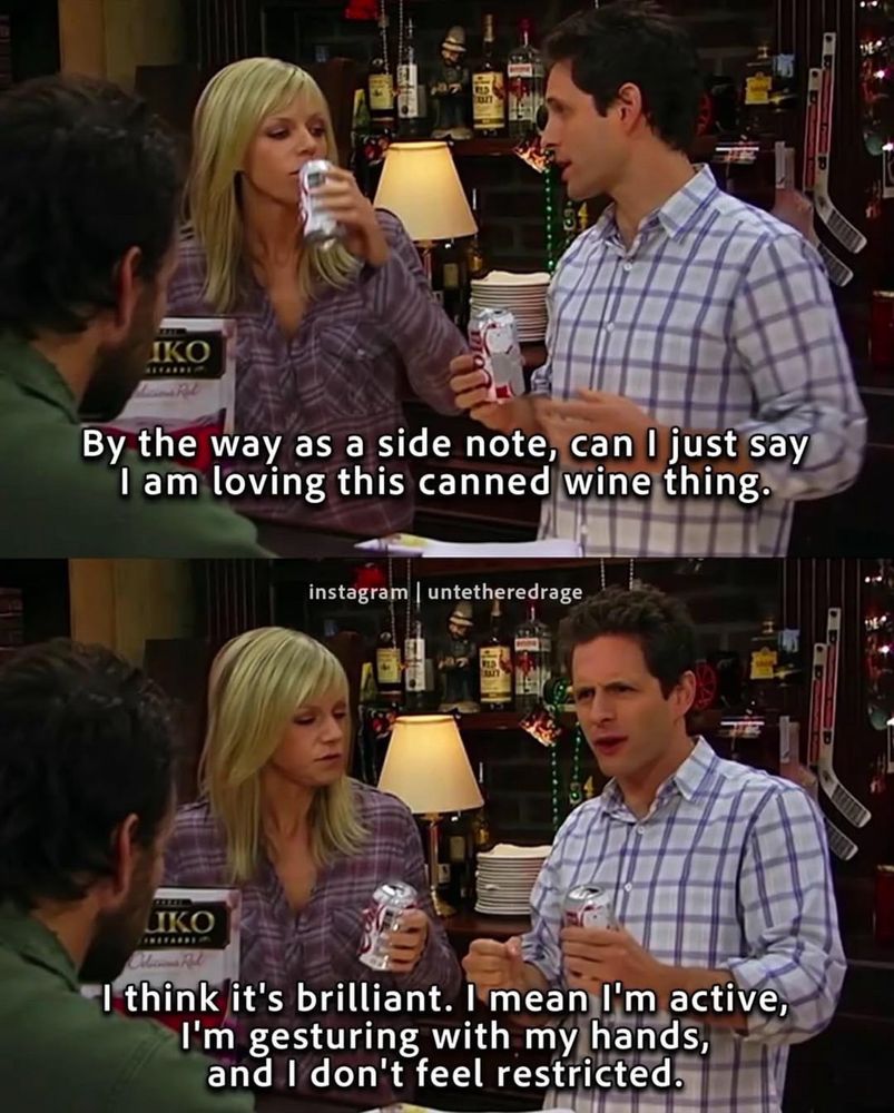 Scene from the TV show It’s Always Sunny in Philadelphia. Two characters, a blonde woman and a man in a plaid shirt, stand at a bar holding canned drinks. The man enthusiastically talks while holding two cans, and the woman drinks from hers. Subtitles read: “By the way as a side note, can I just say I am loving this canned wine thing.” In the next frame he continues, “I think it’s brilliant. I mean I’m active, I’m gesturing with my hands, and I don’t feel restricted.” Another character with dark hair sits with his back to the camera. The bar background shows bottles, decorations, and a hockey stick.