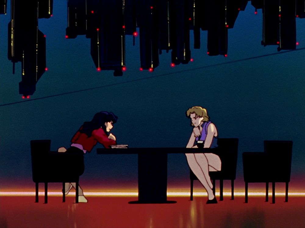Misato and Ritsuko sitting at a table