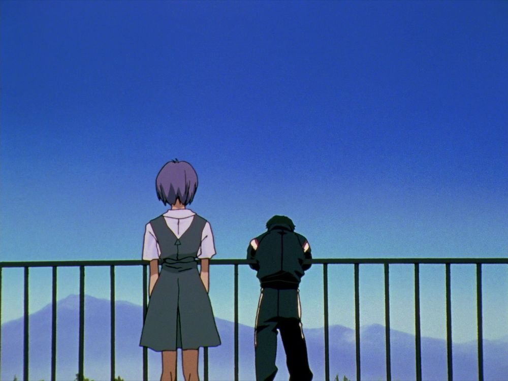 Rei standing behind Toji