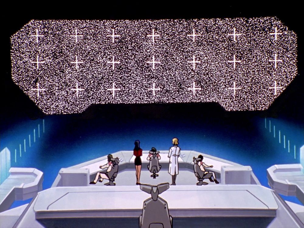 Aoba, Misato, Hyuga, Ritsuko, and Maya looking the screen on the command center bridge