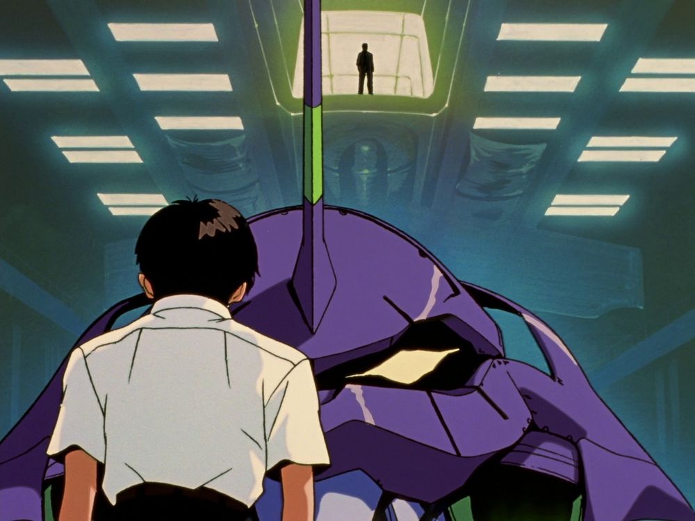 Shinji standing in front of Unit 01 as Gendo stands above them both