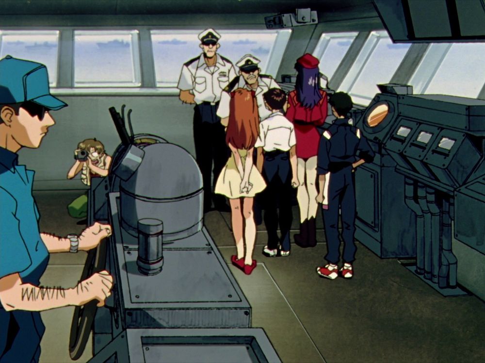 Kensuke, Asuka, Shinji, Misato, and Toji on the bridge of the battleship with the captains