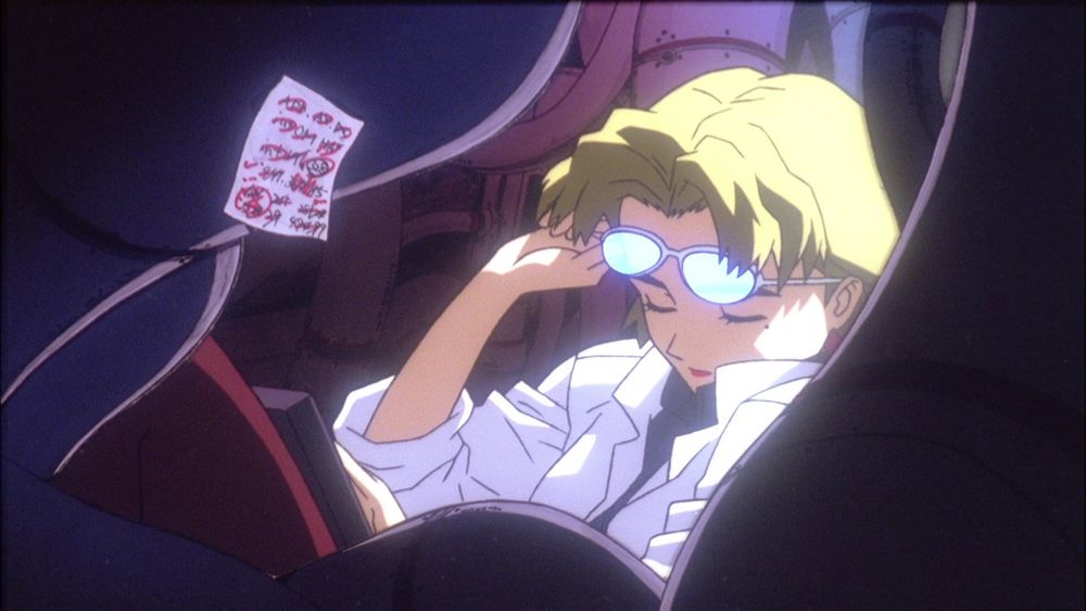 Ritsuko removing her glasses while in the MAGI
