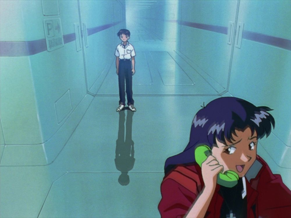 Misato talking on the phone while Shinji just stands there