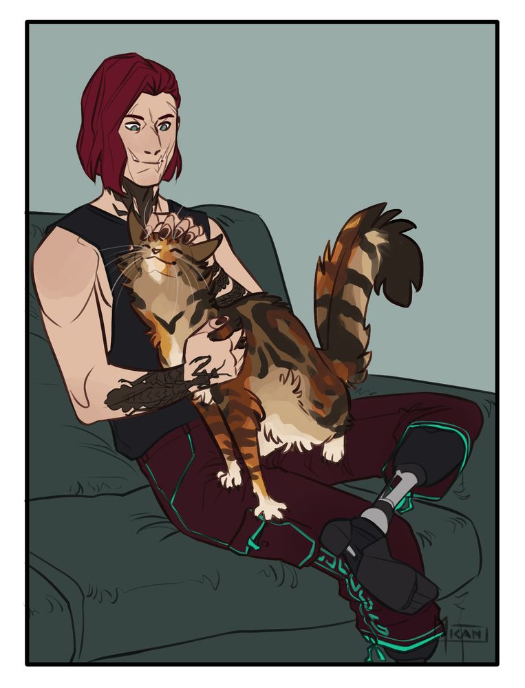 Ilya sitting on a couch with a big tabby/tortoiseshell cat in his lap. They both look very happy.
The cat is kneading his leg with her claws.