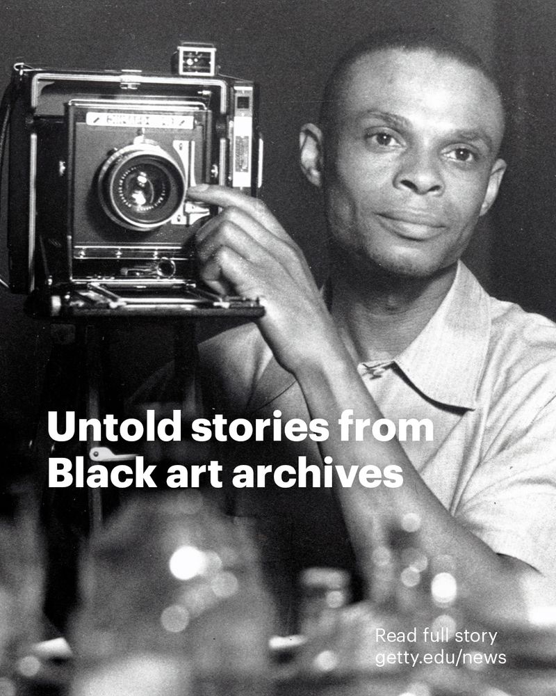 A Black photographer takes a self portrait, text overlayed reads: "Untold stories from Black art archives. Read full story getty.edu/news"
