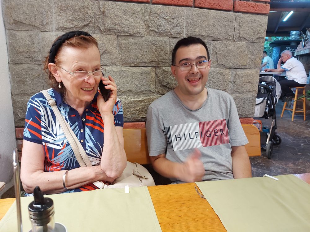 An older woman and me, a semiold man at a dinner table 
