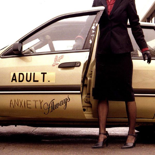 The album cover of “Anxiety Always” by Adult, featuring a dirty beige sedan with the album title painted on the door. A sharply dressed woman emerges from the car, her head out of frame.