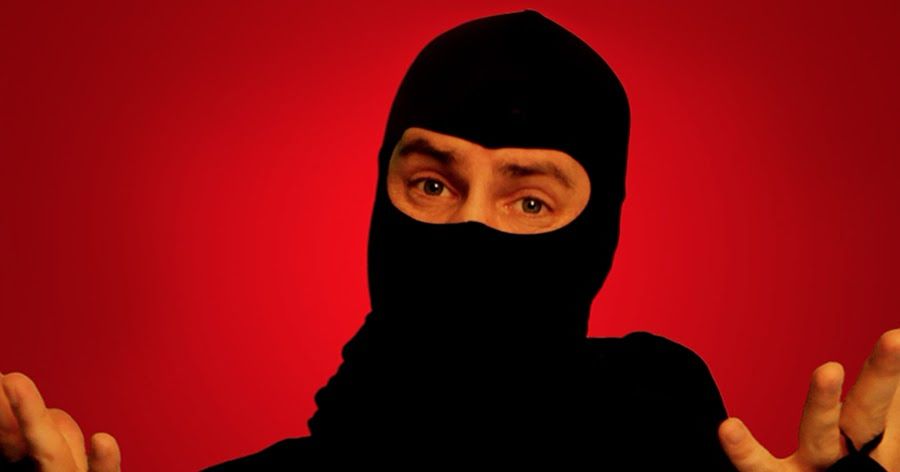 ((The Ask a Ninja Ninja, in black ninja clothes, against a red ninja background, ninja arms raised in a shrug? Possibly an infinite death jutsu.)