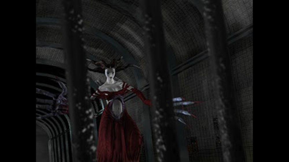 A woman in a dungeon setting, possibly an RPG character due to the visible health bar and UI elements. She is standing behind bars, with her arms outstretched as if casting spells or reaching for something. The environment suggests a dark, underground cell or dungeon.