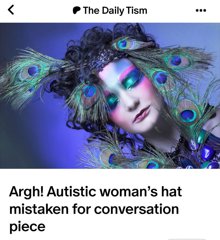 Argh! Autistic woman’s hat mistaken for conversation piece 

Image of young woman in dramatic makeup wearing elaborate peacock hat 