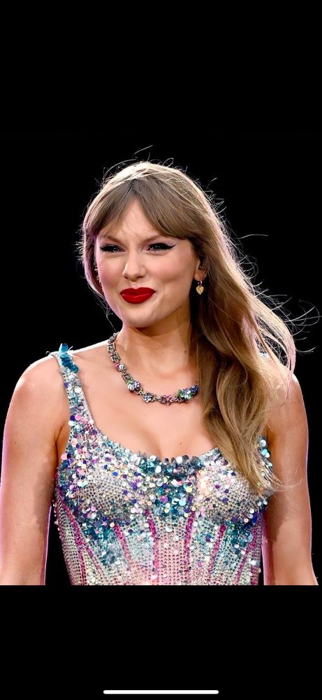 Taylor Swift close up photo. Smiling with tears in her eyes. 