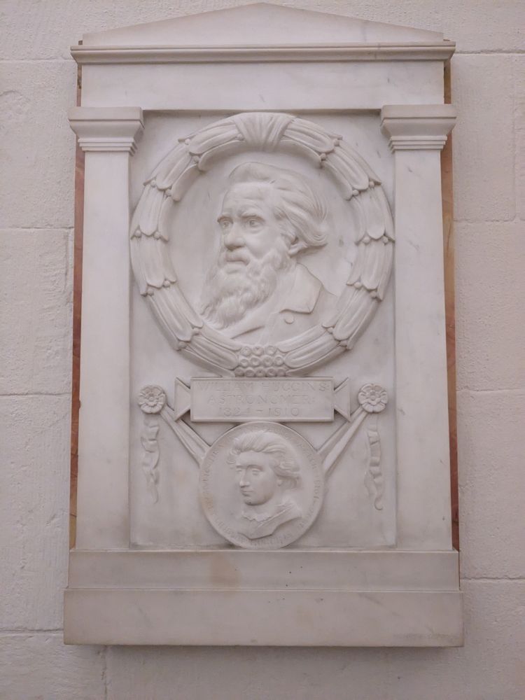White marble depicting William Huggins and Margaret Lindsay Huggins.
