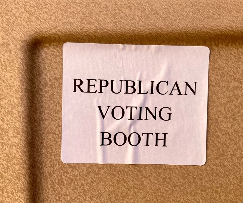 Sticker on side of a porta potty that says Republican voting booth