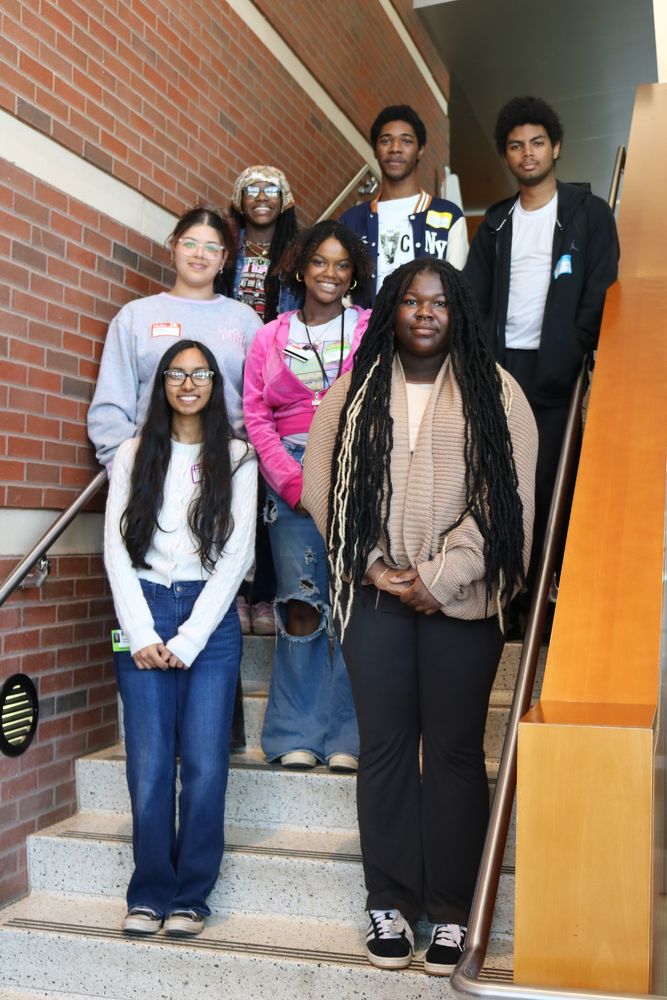 students standing together on stairwell