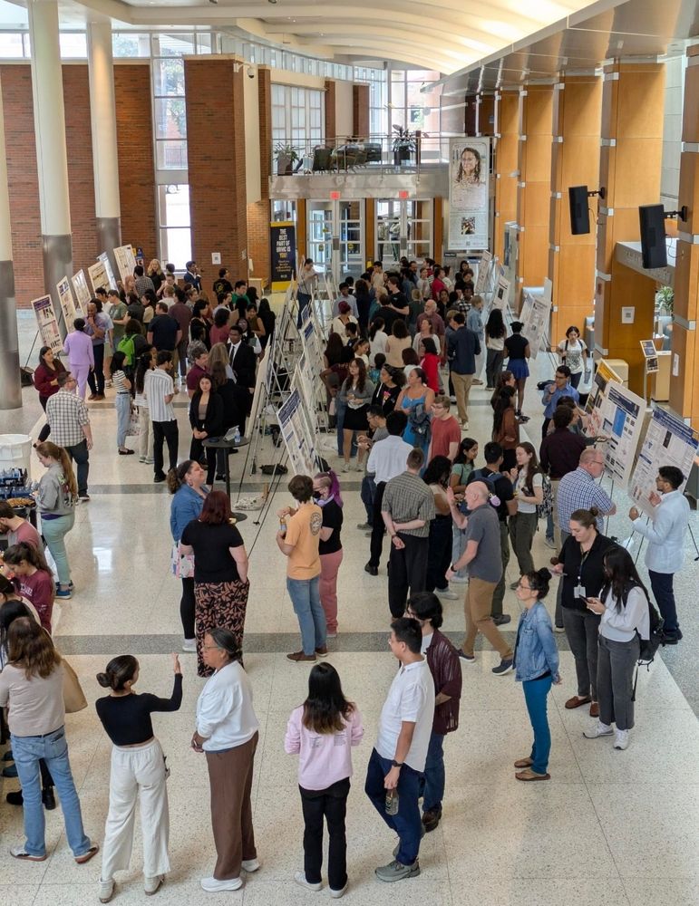 People at scientific poster session
