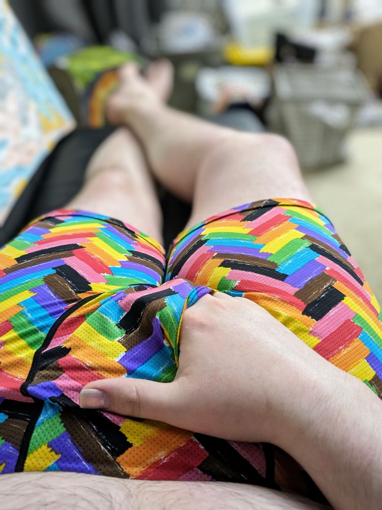 Laying on a couch with hand sliding into underwear.