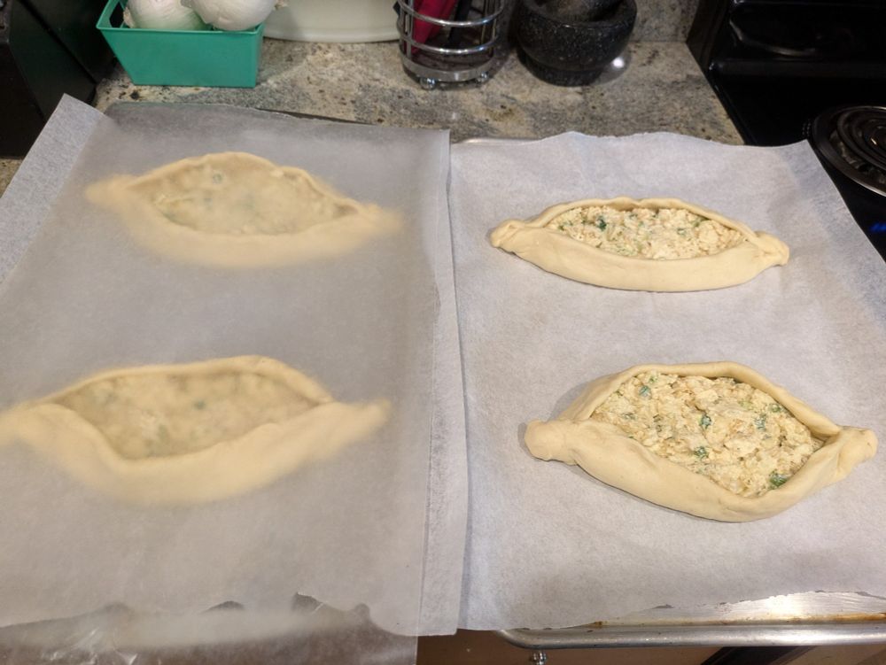 Khachapuri, a cheese filled baked good. These are unbaked and doing their last rise before getting baked