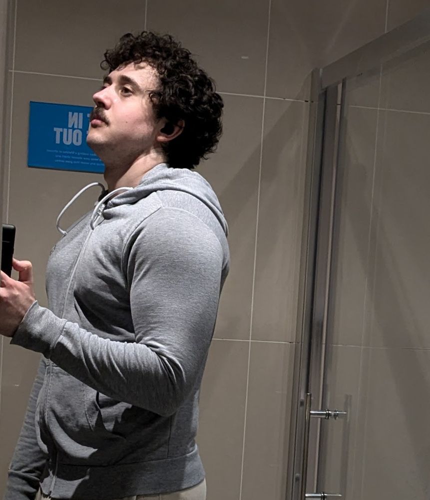 a picture of me wearing a tight hoodie after the gym