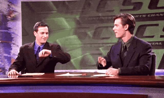 Dan and Casey high five on the set of Sports Night at CSC!