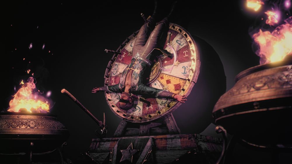 A screenshot of my tav, Outis, on a spinning wheel, upside down, smirking. The wheel is covered in sharp objects, like knives and axes. Outis is blindfolded. 