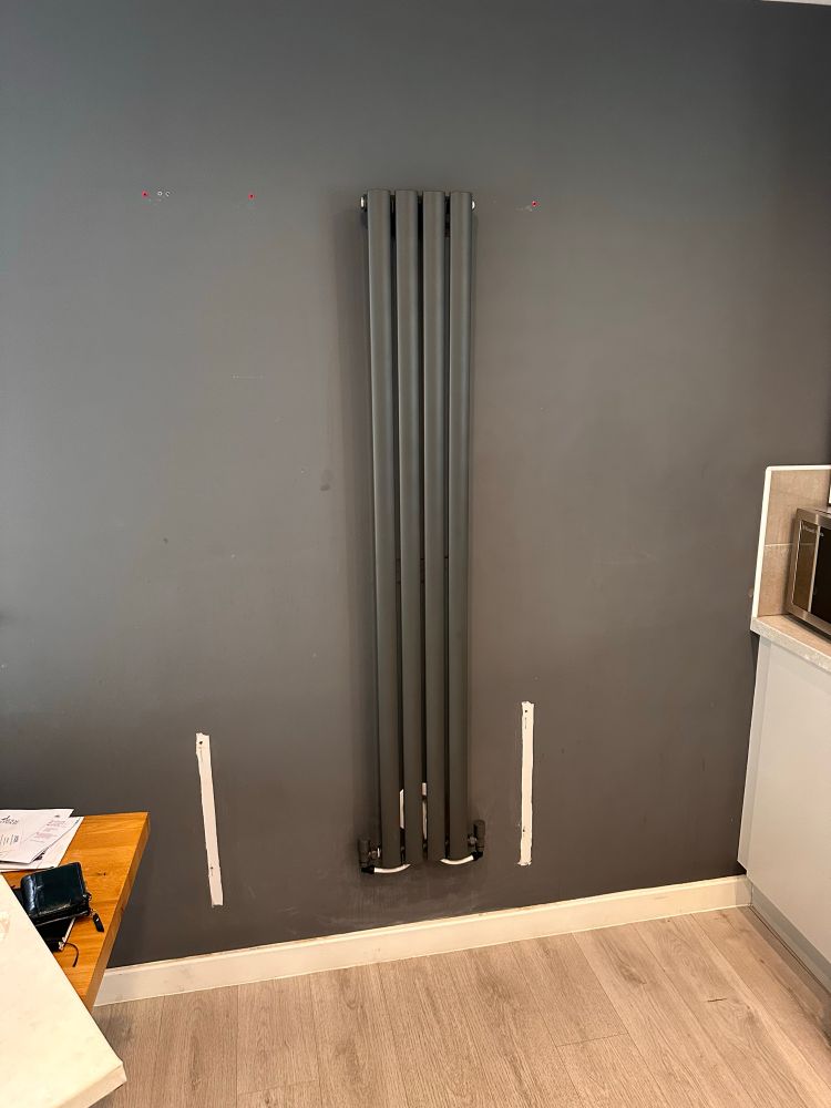 New tall radiator in kitchen 