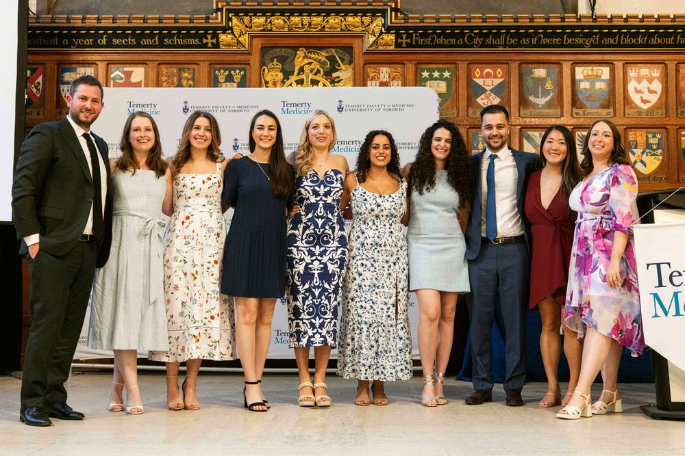 PGY5s on stage, arm in arm