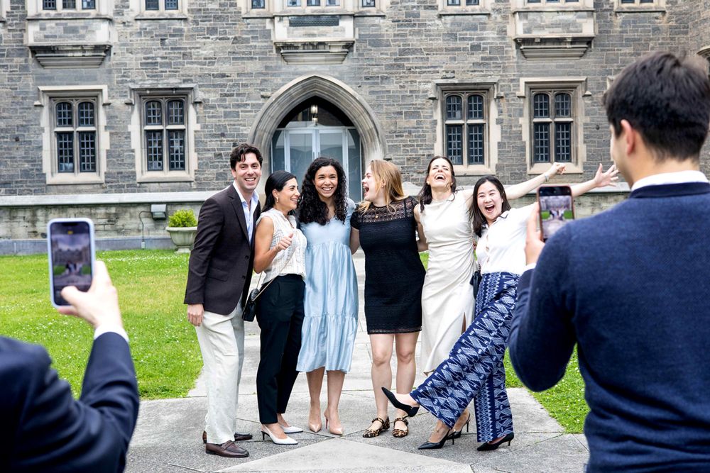 Grads celebrating outside Hart House