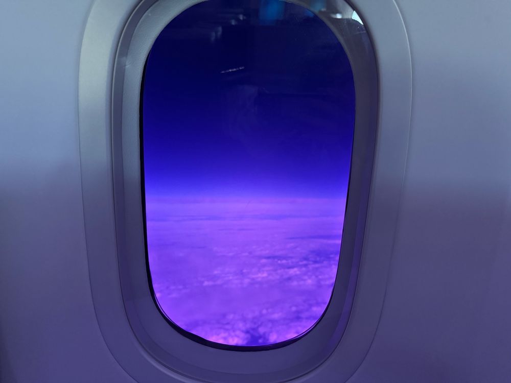 Clouds looking purple as seen through an airplane window with LCD “shades”