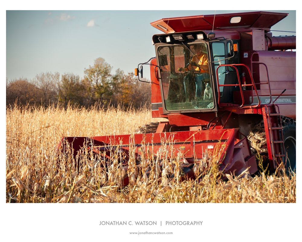 A red combine in the fields of South Dakota 