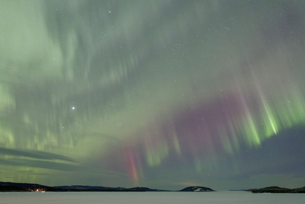 Aurora borealis over a frozen lake in northern Sweden