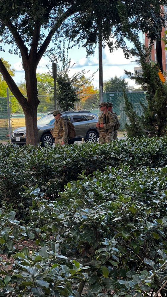 National guard soldiers on the sidewalk 