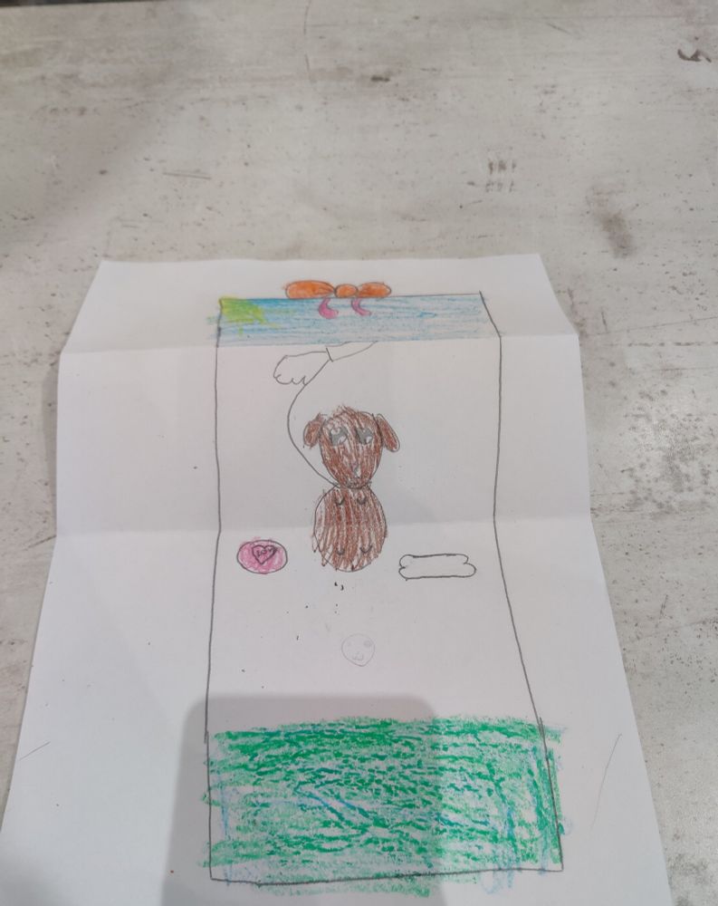 Second picture shows the present being open and inside there is a puppy. 