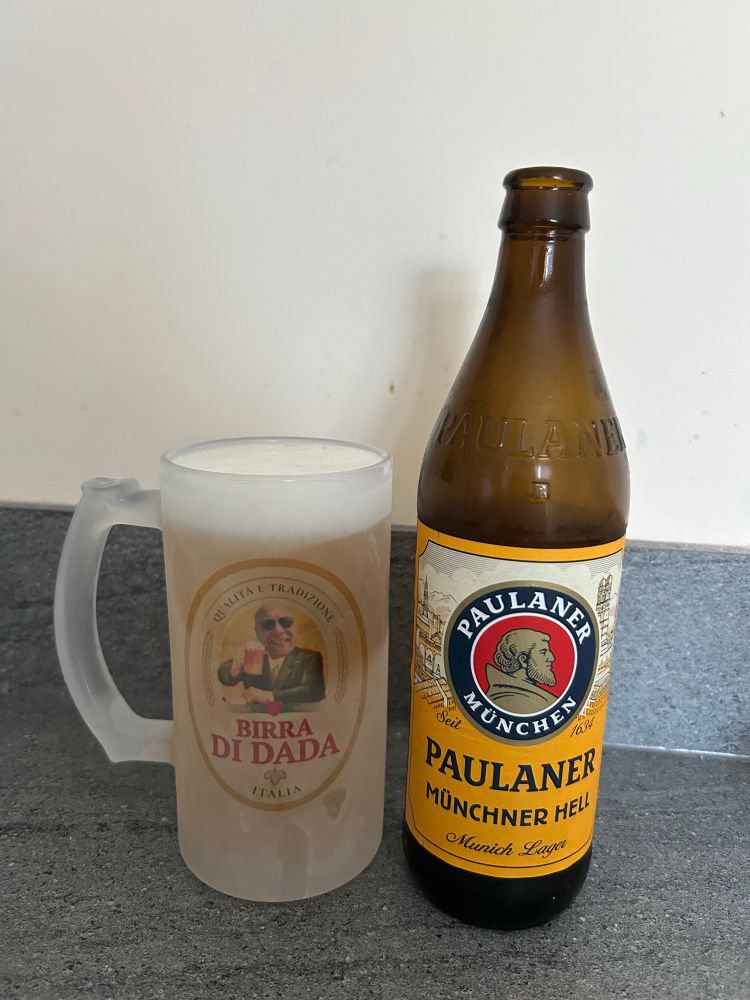 A Paulaner Munchner Hell beer in a chilled glass, which has my face on it (Fathers Day Gift)