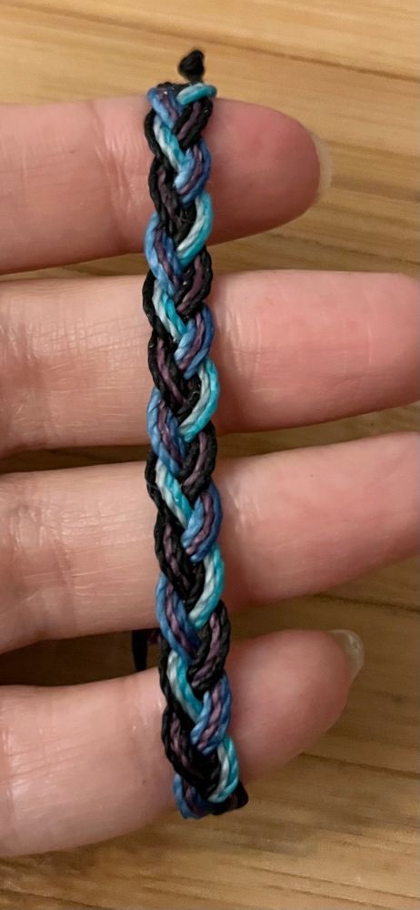 purple, black, and blue braid made of waxed thread