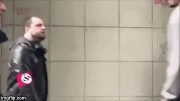 Tall man knocking tge fuck out of a short ass nazi