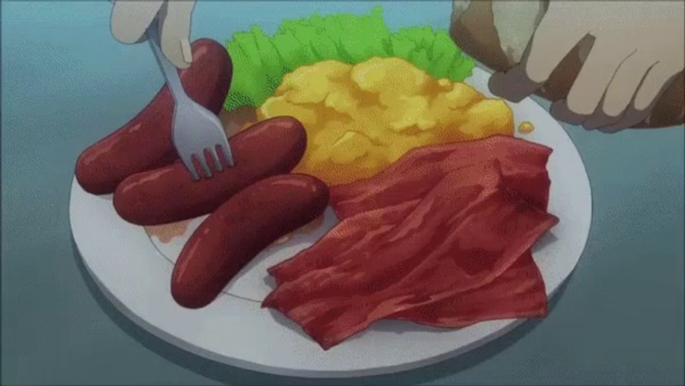 a plate of food with sausages eggs bacon and lettuce