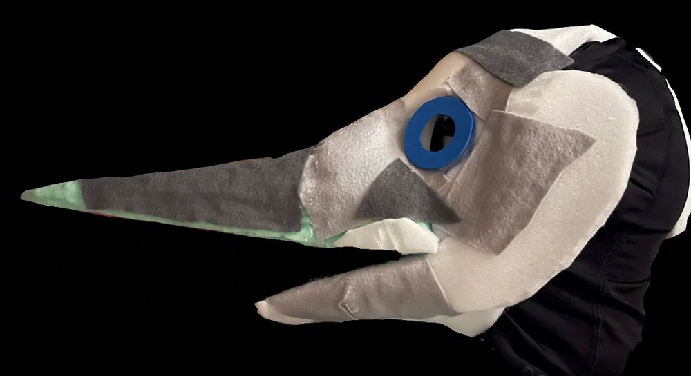 My blue marlin fursuit head base WIP smoothed slightly with small patches of felt covering some of the roughest parts. And mock eyes placed over the eye holes 