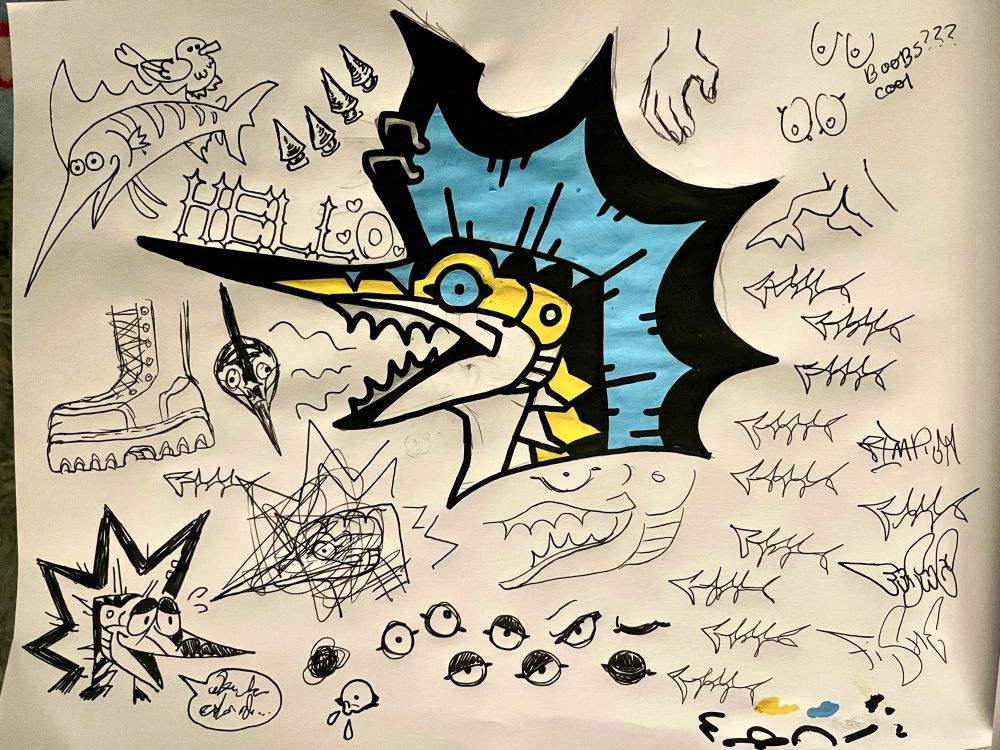 A sketch page full of somewhat random doodles, many centric around my blue marlin fursona Vinny with one large colored headshot in the middle. There are an assortment of eye doodles, mostly at the bottom center with different emotions. The right side of the page mostly features practice tags. 