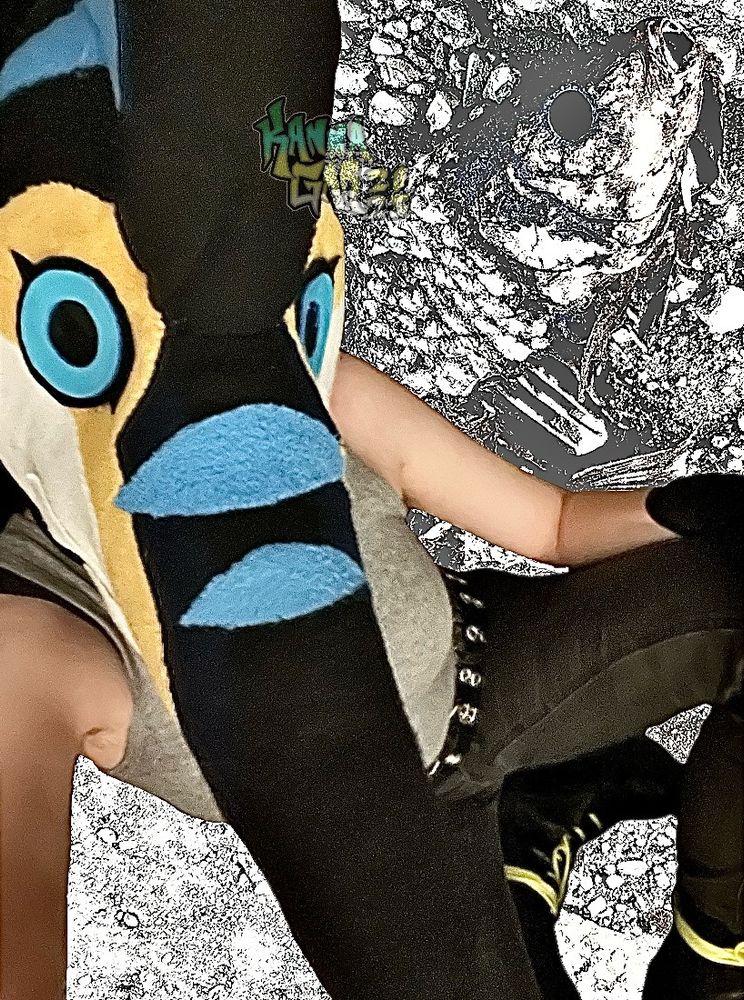 Another edited photograph of me in my marlin fursuit head. There is a heavily edited photograph of a dead fish behind me. 