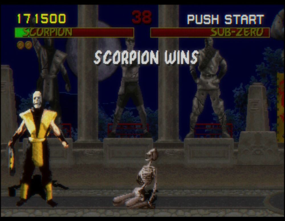 Scorpion next to a burned-up skeleton in Mortal Kombat (1992)