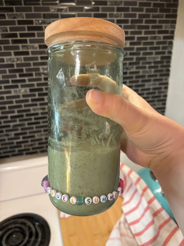 Sourdough starter in a green jar