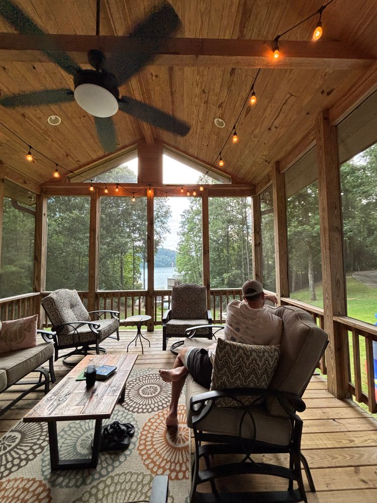 Screened in porch with a lake view
