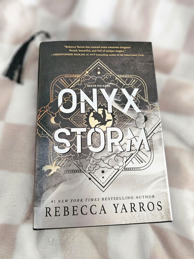 Pictures is the book Onyx Storm by Rebecca Yarros. 