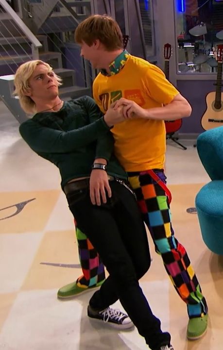 Calum Worthy (as Dez) dancing and dipping Ross Lynch (as Austin Moon) on Austin & Ally.