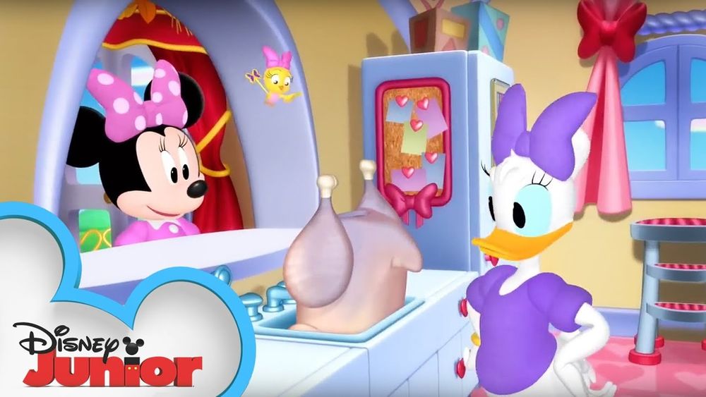 Daisy Duck and Minnie Mouse looking at an uncooked turkey in a sink from Disney Junior.